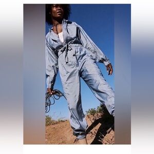 NWT FP Movement by Free People size S Golden hour jumpsuit